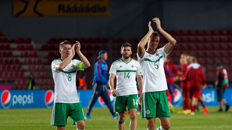 Northern Ireland's Steven Davis, Stuart Dallas and Jonny Evans applaud the fans