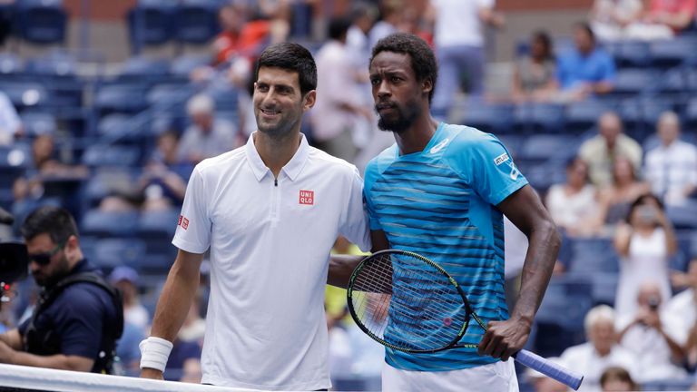 Novak Djokovic and Gael Monfils pose for a photo before playing in the semifinals of the US Open 