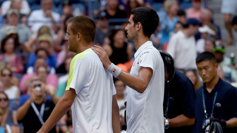Mikhail Youzhny of Russia retires from the match against Novak Djokovic of Serbia during their US Open 2016 men's single match at the USTA Billie Jean King