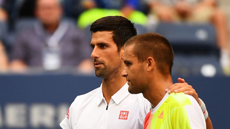 NEW YORK, NY - SEPTEMBER 02:  Mikhail Youzhny of Russia (R) retires to Novak Djokovic of Serbia during his third round Men's Singles match on Day Five of t