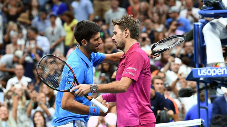 Stan Wawrinka of Switzerland embraces Novak Djokovic of Serbia after winning the US Open

