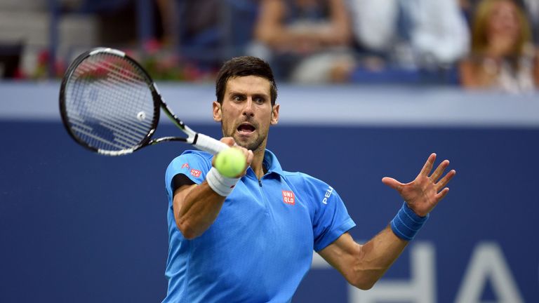 Novak Djokovic of Serbia hits a return against Stan Wawrinka