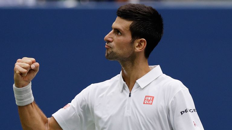 Novak Djokovic reacts after winning a game against Gael Monfils