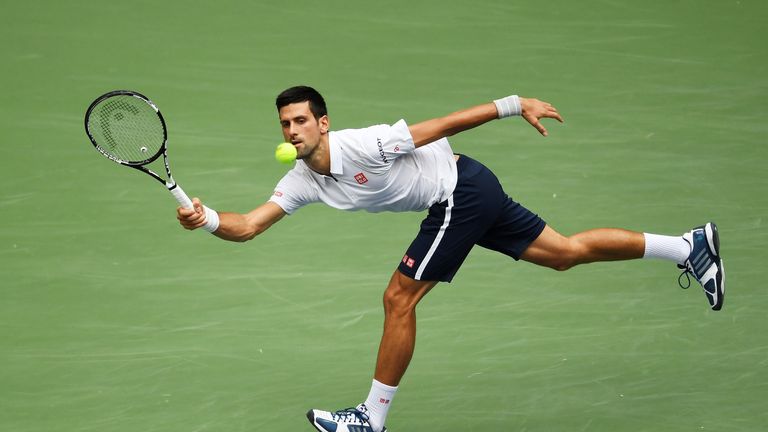 NEW YORK, NY - SEPTEMBER 09:  Novak Djokovic of Serbia returns a shot to Gael Monfils of France during their Mens Singles Semifinal Match on Day Twelve o