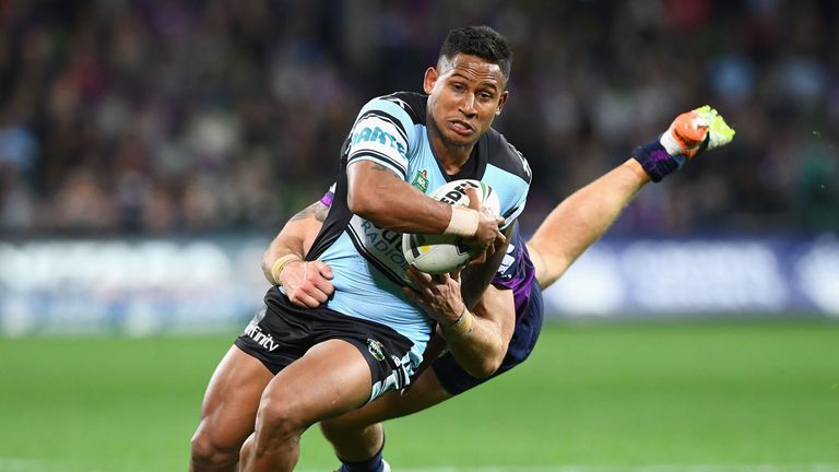 Ben Barba of the Sharks is tackled by Cheyse Blair