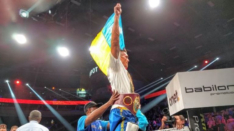 Oleksandr Usyk celebrates becoming world champion