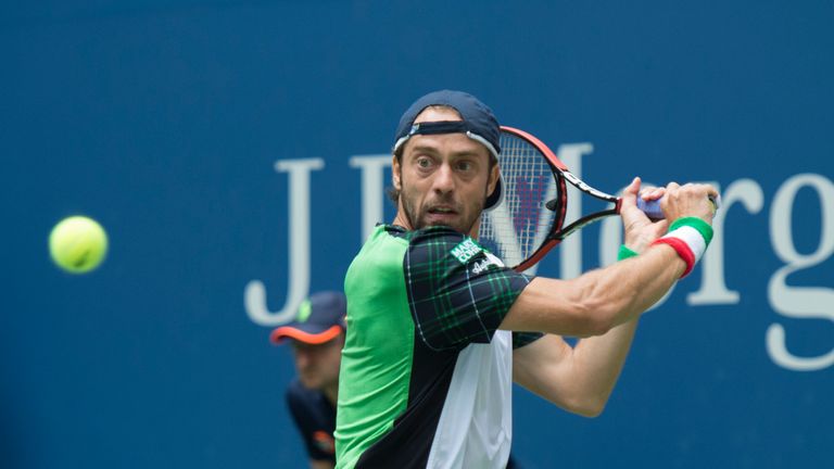 Paolo Lorenzi of Italy hits a return to Andy Murray of Great Britain during their 2016 US Open men's singles match at the USTA Billie Jean King National Te