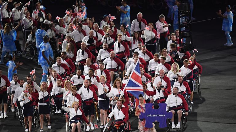 Flagbearer Lee Pearson leads the British Paralympic team