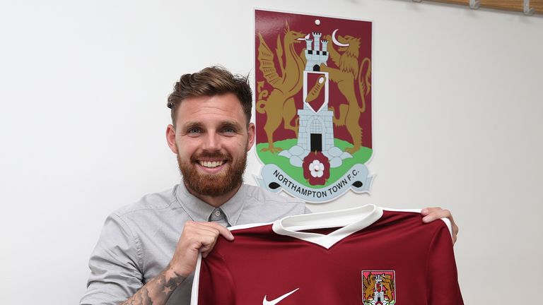 Northampton Town new signing Paul Anderson poses with a shirt during a photo call at Sixfields Stadium on August 31, 2016
