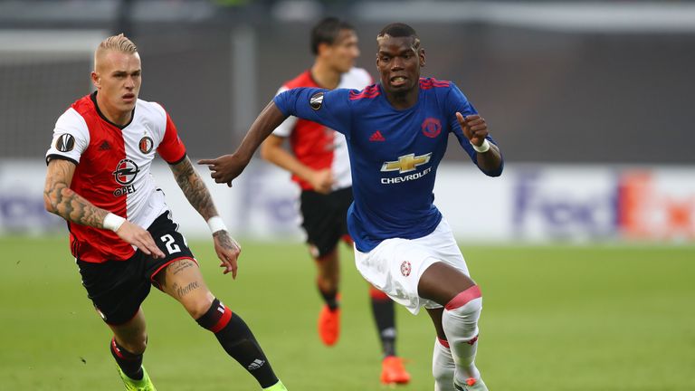 Rick Karsdorp of Feyenoord chases down Paul Pogba of Manchester United during the UEFA Europa League Group A match 