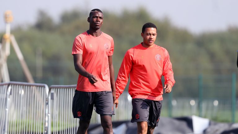 Manchester United's Paul Pogba (L) and Memphis Depay during a training session at Aon Training Complex