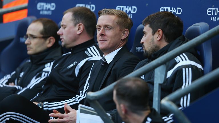 Pep Clotet (right) pictured alongside Garry Monk in the dugout at Swansea