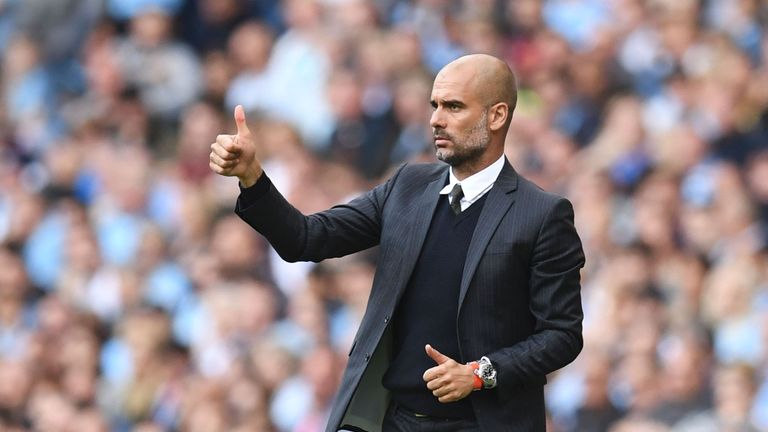 Manchester City's Spanish manager Pep Guardiola gives a thumbs up from the touchline during the English Premier League football match between Manchester Ci