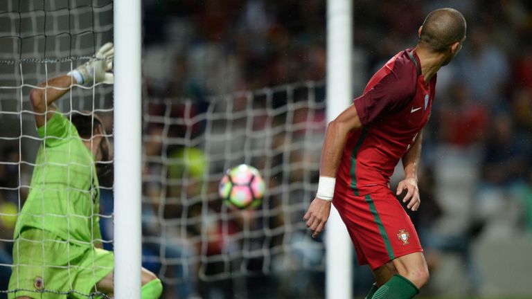 Portugal's defender Pepe (R) looks at the ball after scoring the fifth goal against Gibraltar during the friendly football match Portugal vs Gibraltar at B
