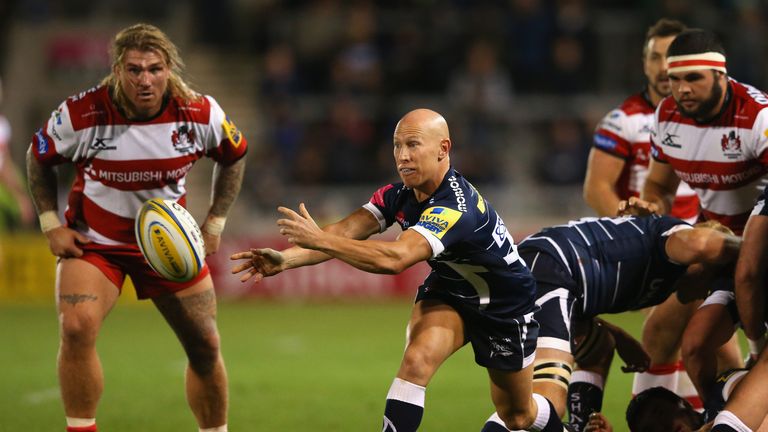 Peter Stringer of Sale Sharks passes the ball out from a scrum during the Aviva Premiership match between Sale Sharks and Gloucester