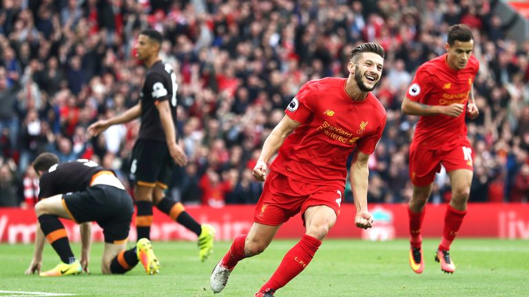 Adam Lallana celebrates after scoring for Liverpool at Anfield
