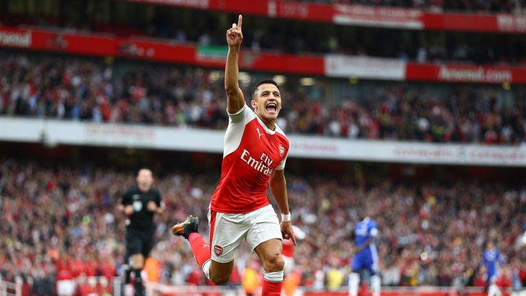 Alexis Sanchez celebrates scoring the opening goal of the game at the Emirates Stadium