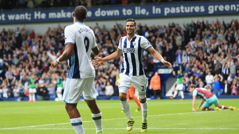 Nacer Chadli celebrates scoring his sides first goal with Salomon Rondón of West Brom