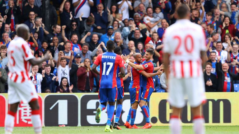 Andros Townsend (C) celebrates his goal with team-mate Joel Ward