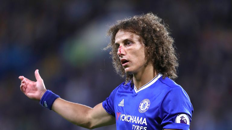 David Luiz looks on with a blooded nose at Stamford Bridge