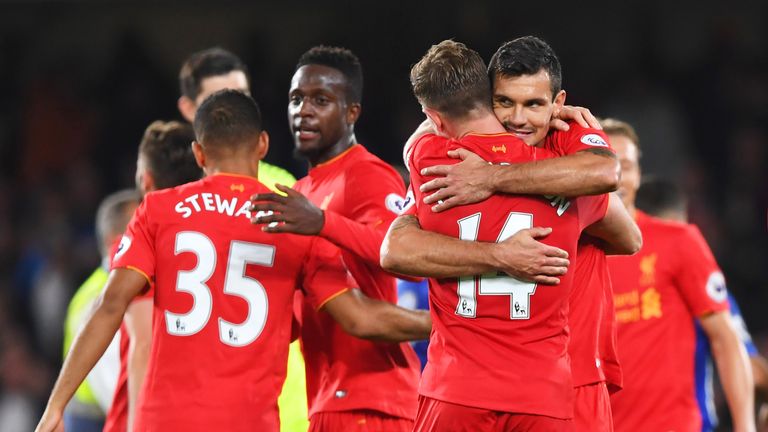 Goalscorers Jordan Henderson (14) and Dejan Lovren celebrate victory over Chelsea at Stamford Bridge