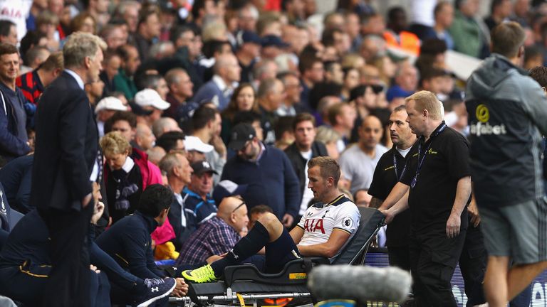 Harry Kane is stretched off during the second half at White Hart Lane