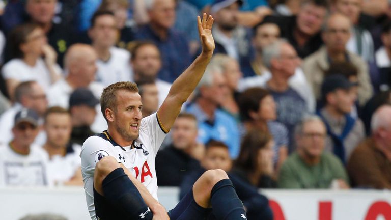 Harry Kane gestures to the bench after picking up an injury