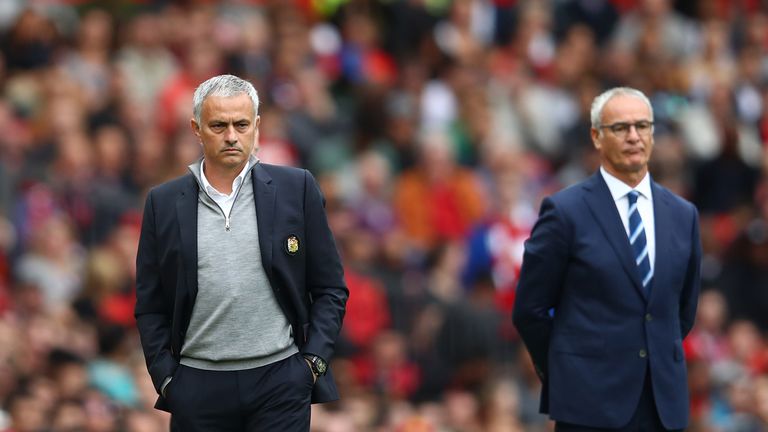 Jose Mourinho (L) and Claudio Ranieri look on at Old Trafford