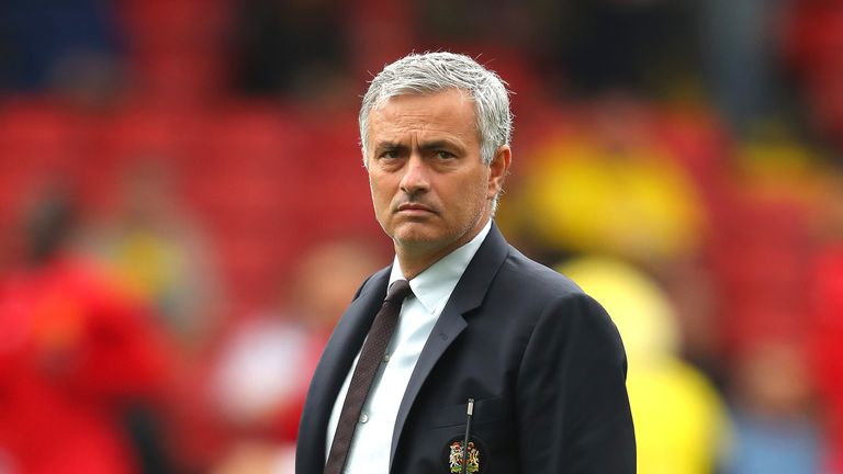 Jose Mourinho looks on prior to kick-off at Vicarage Road