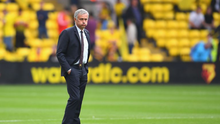  Jose Mourinho takes a look at the pitch prior to kick-off 