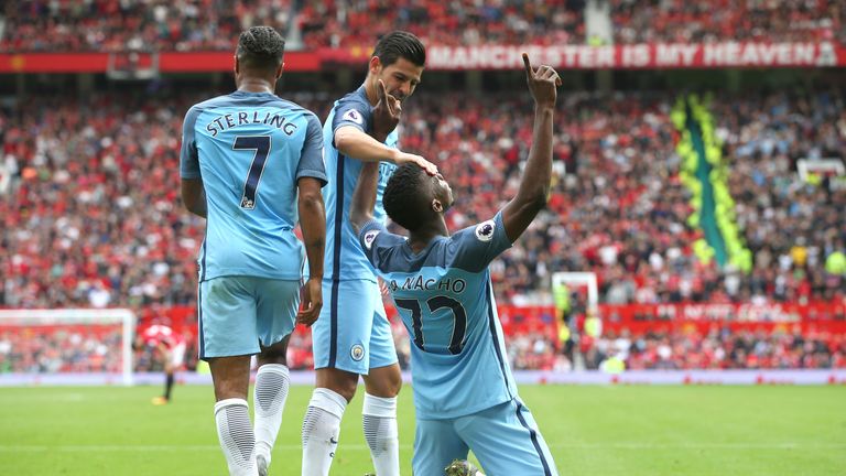 Kelechi Iheanacho (R) celebrates scoring Manchester City's second goal with team-mates