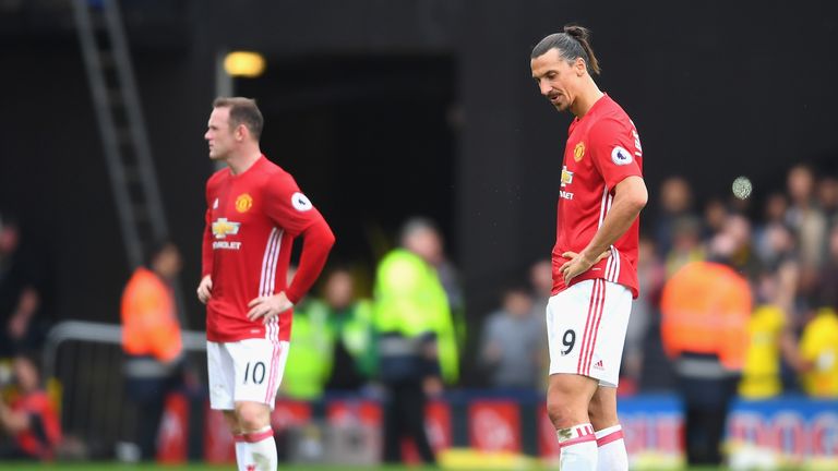 Wayne Rooney and Zlatan Ibrahimovic look on from the centre spot