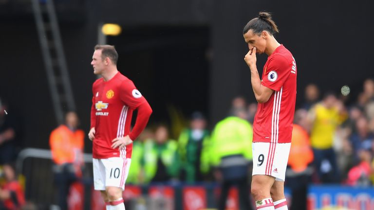Wayne Rooney and Zlatan Ibrahimovic look on from the centre spot