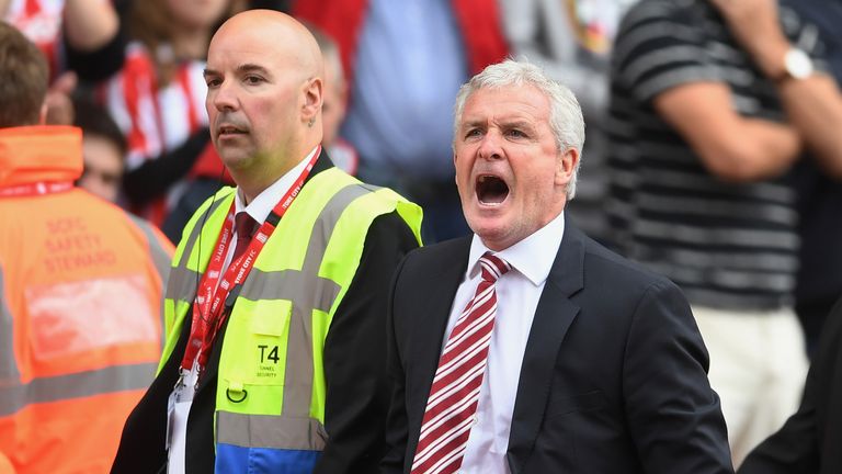 Mark Hughes reacts after being sent to the stands