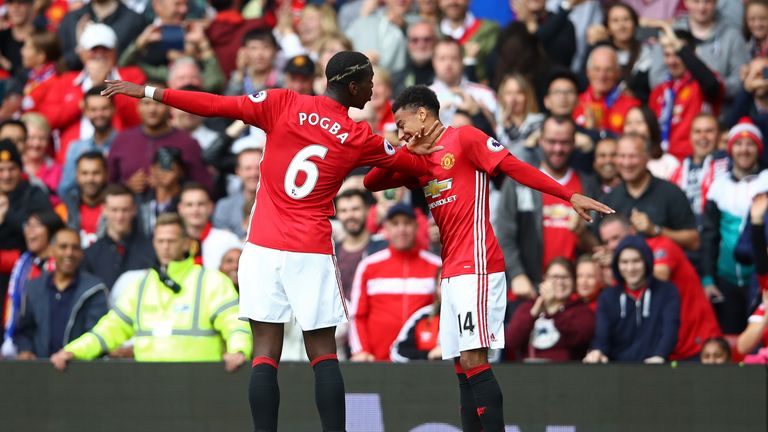 Paul Pogba (L) performs the Dab with Jesse Lingard after scoring for Manchester United