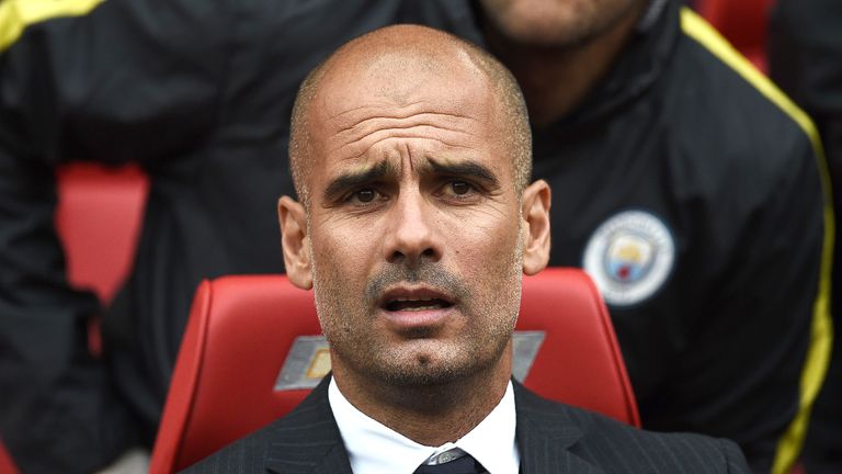 Pep Guardiola awaits kick off in the Manchester derby at Old Trafford