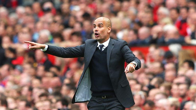 Pep Guardiola reacts on the touchline at Old Trafford