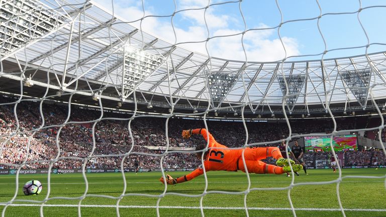 Adrian of West Ham United dives in vain as Charlie Austin of Southampton (not pictured) scores their first goal during the