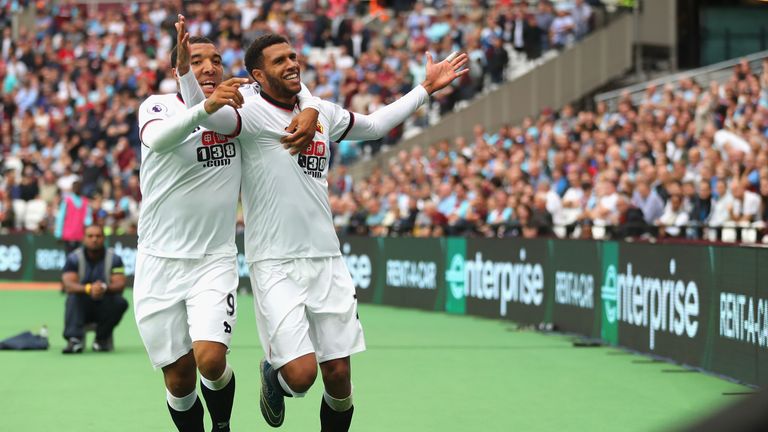 Etienne Capoue (R) celebrates Watford's third goal with Troy Deeney