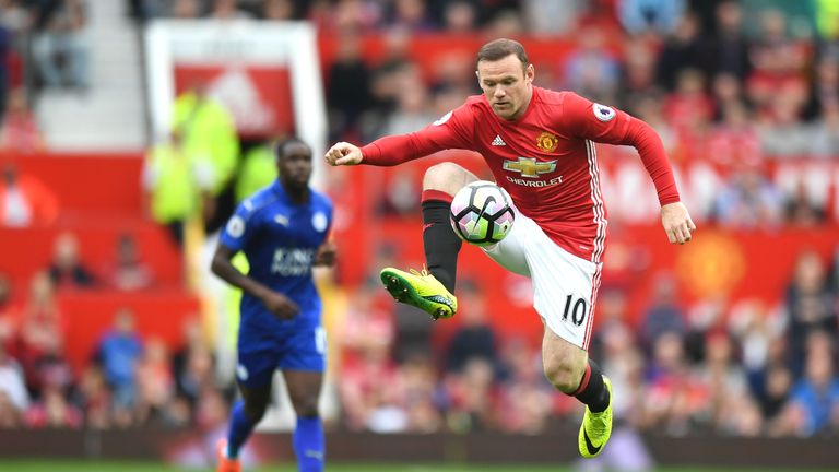 Wayne Rooney (R) in action for Manchester United after coming on as a substitute