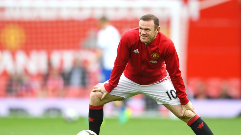 Wayne Rooney warms up prior to kick-off at Old Trafford