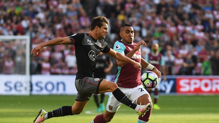 LONDON, ENGLAND - SEPTEMBER 25:  Dimitri Payet of West Ham United and Cedric Soares of Southampton battle for the ball during the Premier League match betw