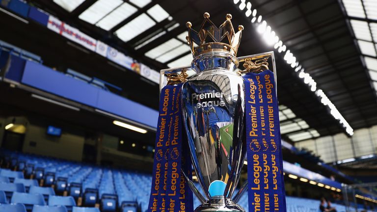 The Premier League trophy on display prior to the Premier League match between Chelsea and Liverpool at Stamford Bridge