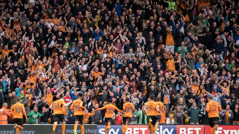 Wolverhampton Wanderers players and fans celebrate after Prince Oniangue scored the opening goal during the Sky Bet 
