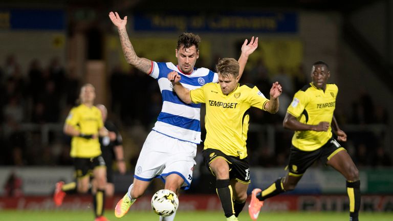 Jamie Ward of Burton Albion and Grant Hall of Queens Park Rangers in action 