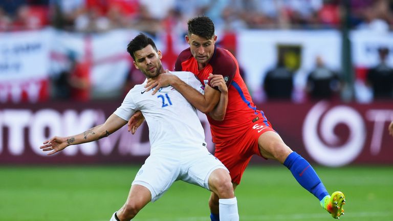 Gary Cahill tangles with Slovakia's Michal Duris 