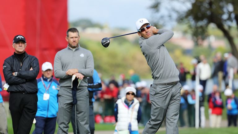 Rafa Cabrera-Bello tees off under the watchful eye of Lee Westwood