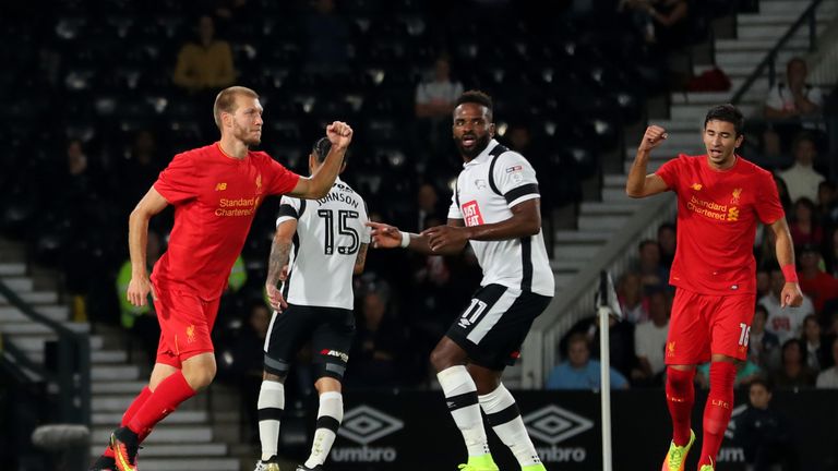 DERBY, ENGLAND - SEPTEMBER 20:  Ragnar Klavan (L) of Liverpool celebrates scoring the opening goal during the EFL Cup Third Round match between Derby Count