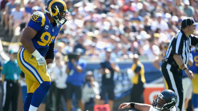 LOS ANGELES, CA - SEPTEMBER 18:  Quarterback Russell Wilson #3 of the Seattle Seahawks reacts after being sacked by Aaron Donald #99 of the Los Angeles Ram