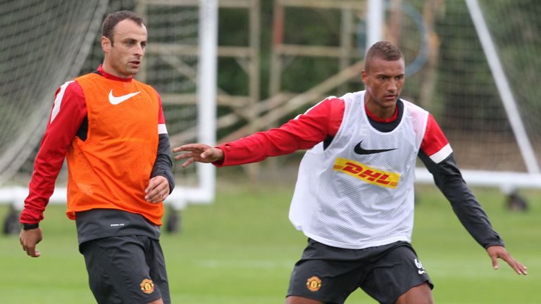 MANCHESTER, ENGLAND - JULY 13:  Dimitar Berbatov (L) of Manchester United clashes with Reece Brown during first team training session at Carrington Trainin